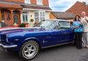 Colin and Christine Dixon with the 1966 Ford Mustang GT won in a prize draw. Pic - Bridge Classic Cars