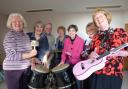 Sandra Trewin, Pat Woodhouse, Andrew Sherrey, Gaye Hadley, Sue Dennis, Janice Boswell and Penny Grimley prepare for Sunfield’s fundraising evening of music