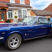Colin and Christine Dixon with the 1966 Ford Mustang GT won in a prize draw. Pic - Bridge Classic Cars