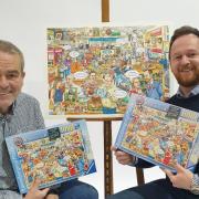 Nick Davies and Will Farmer, directors of Fieldings Auctioneers, with The Auction House jigsaw