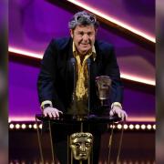 John Dower of Mindhouse Productions collecting the BAFTA for best factual series for Lockerbie on May 12