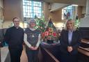 Rev Andrew Sillis, Emma Leek and Suzanne Webb at the Christmas Tree Festival at St Thomas's Church with the winning entry by Happy Patchers