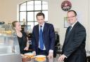 Let me eat cake! George Osborne with Dudley South Tory candidate Mike Wood and cafe owner Sharon Henderson