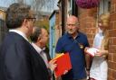Tom Watson MP and cllr Pete Lowe chat with Amy Ashmore on the doorstep