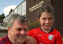 Dudley councillor Tim Crumpton and his granddaughter Kacey Bates, 9, are auctioning off a signed West Bromwich Albion football for our Well of Life appeal. 151511L