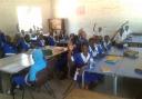 Children at Madiana Lower Basic School in The Gambia with the chairs and tables donated by Newfield Park Primary School