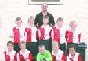 Kitted out: Stourbridge Glassboys West U9s with Alex Coalbourne, manager of The Thorns Carvery.