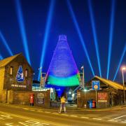 The Red House Glass Cone lit up in blue