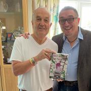 Author Andrew J Mullaney, right, presenting Cllr Steve Waltho, left, with a copy of the book