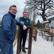 Stourbridge golf professional Mark Male and club captain Colin Bullock show off the new patio at Stourbridge Golf Club