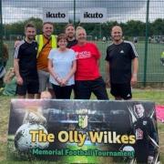 Simon and Lynn Wilkes, front centre, with son Ben and directors from Ikuto - one of the event sponsors.