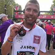 Jason Connon with his medal after completing the 2022 London Marathon