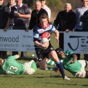 Matt Farrington leaves two Sutton tacklers in his wake