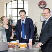 Let me eat cake! George Osborne with Dudley South Tory candidate Mike Wood and cafe owner Sharon Henderson
