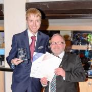 Former King Edward VI pupil Philp Brookes receiving his award from the University of Worcester’s John Ryan.
