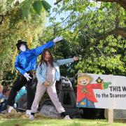 Isobel Cunliffe, aged seven, with Microw Jackson - a straw-stuffed tribute to the late King of Pop, Michael Jackson. Pic by Miriam Balfry