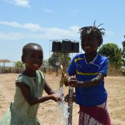 Young villagers share their joy as water flows thanks to Project Gambia and the Well of Life appeal. picture by Gillian Broadhead