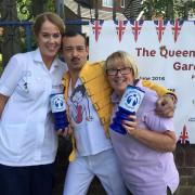 Rachel Finlayson, day services unit nurse, Freddie Mercury, aka Johnny Will, and hospice therapist Judy Taylor prepare for Mary Stevens Hospice’s Queen’s birthday celebrations