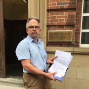 Dr David Nicholl with the letter he wrote to Birmingham coroner Louise Hunt