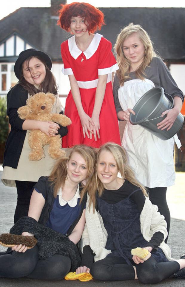 Left to right, back, Amelia Jones, aged ten, Amber Hughes as Annie, aged 12, Beth Henwood, aged 15, front, Holly Watson, aged 14, and Melissa Parsons, aged 13. Buy photo: 111210J