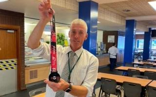Pete Teale with his latest marathon medal. Pic - Old Swinford Hospital