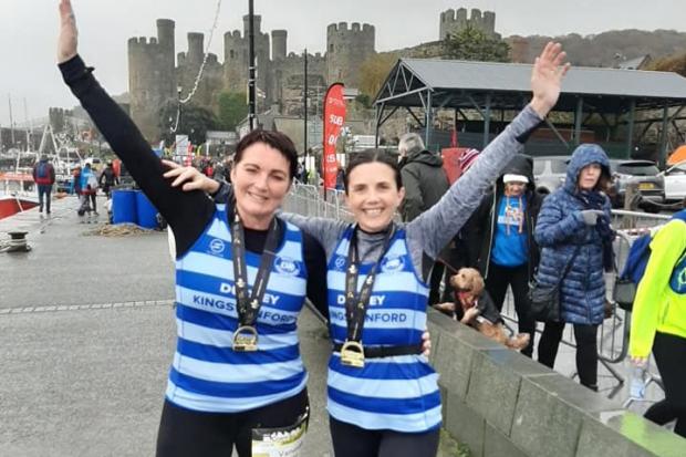 Vanessa Harris and Farrah Hunter-Coley with medals after finishing the Conwy half marathon