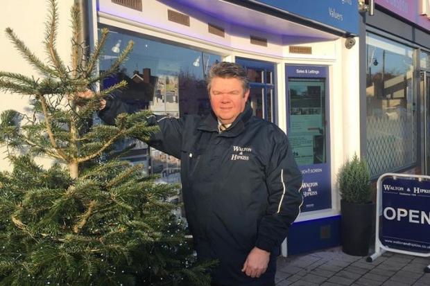 Andrew Hipkiss and the tree outside Walton and Hipkiss in Hagley