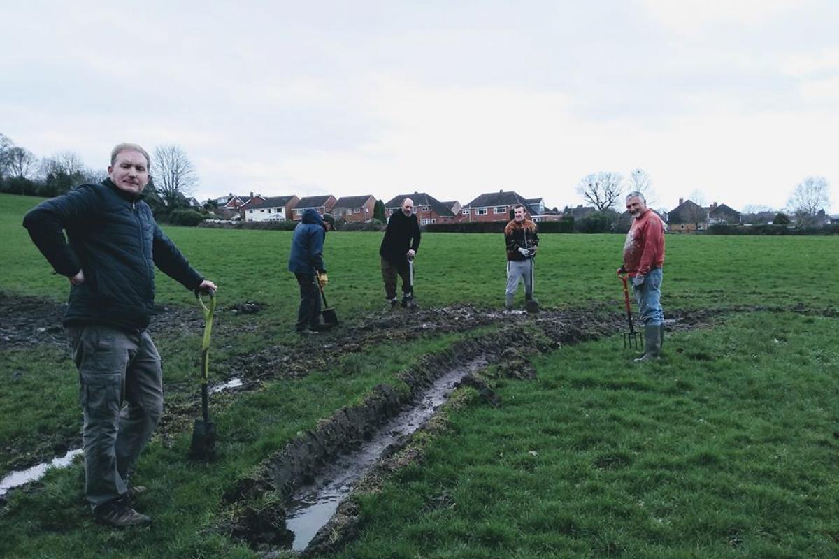 Volunteers have been working to repair the damage caused by vehicles which have churned up the grass in Wollescote Park. Pic courtesy of Julia Marks