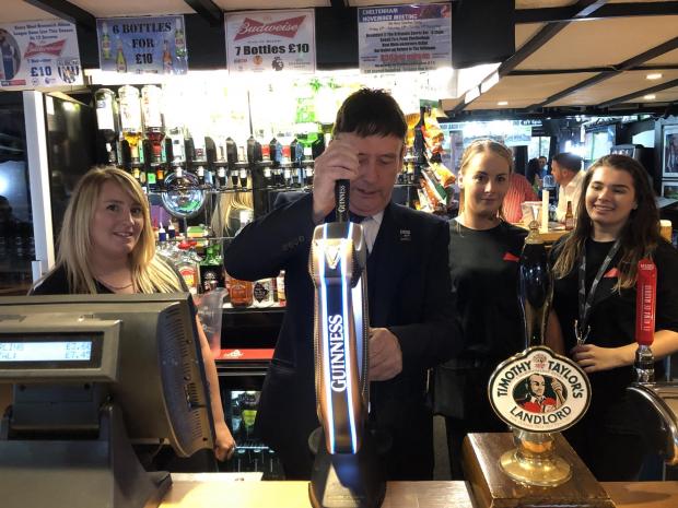 Stourbridge News: Jimmy White pulls a pint at The Britannia Sports Bar