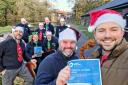 Cllr Wayne Little, Gemma Coley of the Canal & River Trust (in sleigh) with trust volunteers and CRT’s Keith Stevens with Cllr Adam Davies, front right, getting ready for Christmas at Delph Stables.