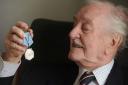 HERO AIRMAN'S MEDAL: Eric Carter, 94, with his Ushakov medal. 361412ET