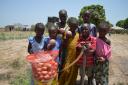 Sintet villages with one of the bags of onions which have grown at the farm which was backed by Stourbridge News’ Well of Life Appeal. Photo: Project Gambia