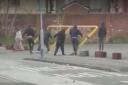 Captured on camera: a group of people were seen pushing over the car park barrier in Jackson Street, Lye, on Sunday January 27.
