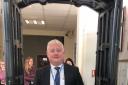 Headteacher Gareth Lloyd walking through the knife arch. Pic - Stourbridge Police