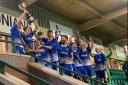 Lye Town players celebrate victory in the JW Hunt Cup final