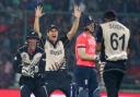 New Zealand's Luke Ronchi, left, and teammate's Ross Taylor and Ish Sodhi, right, celebrate the dismissal of England's Eoin Morgan, second right, during their ICC Twenty20 2016 Cricket World Cup semifinal match at the Feroz Shah Kotla Cricket