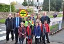 Dudley South MP Mike Wood with long-serving school crossing patrol Delia Mills and staff and pupils from Belle Vue Primary School