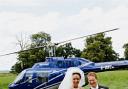 The happy couple, Gemma and Craig, arrive at their wedding reception after a surprise helicopter trip.