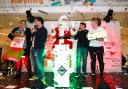 Competition winner Laura Cheese, pictured left, with celebrities Sam and Mark at the Christmas lights switch on. Pic by Shaun Fellows / Shine Pix