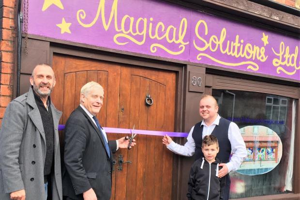 Magicians - Tracie Hughes, John Milner, David Pitt and Robert Pitt, aged seven, celebrate the opening of the new-look Magical Solutions shop in Brook Street.