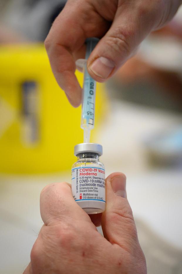 Stourbridge News: A Covid vaccine being prepared. Credit: PA