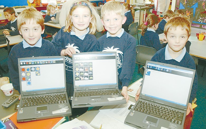 Ready to have a go with laptops shared by Pershore High School are Fladbury CE First School pupils Jack Hancock, Louise Chilman, Henry Ingles and Nicholas Southcott in January 2003
