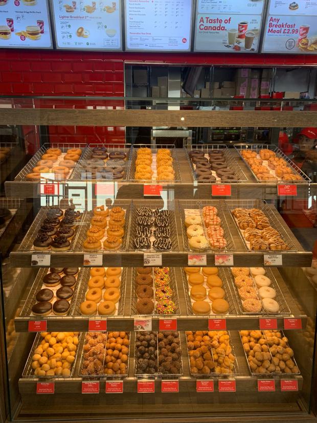 Stourbridge News: Fully stocked shelves of doughnuts. 
