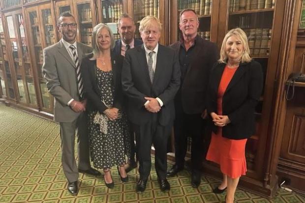 L-r - Jason Connon, Debbie Pelaud , Adrian Passey with Prime Minister Boris Johnson, centre, private investigator Russ Whitfield and Stourbridge MP Suzanne Webb.