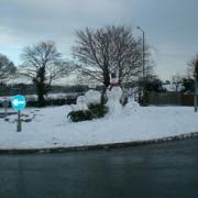 Snowmen bring smiles to motorists