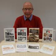 Terry Church pictured with copies of all eight books he has published to date