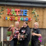 Trina Keane, left, and Eddy Morton, right, with musician Jess Silk, centre, who is set to play at Glastonbury this year. 
Pic by Linda Aitchison