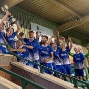 Lye Town players celebrate victory in the JW Hunt Cup final