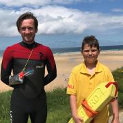 Finley Hassall, right, with RNLI lifeguard Guy Potter