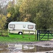 The caravan where a man had been living on canalside parkland by Stourbridge Canal for about a year